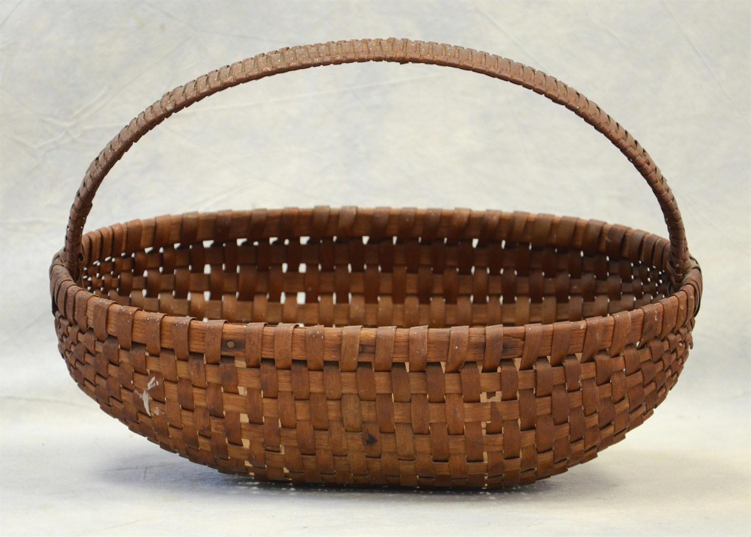 Appraisal: Oak ash splint basket rare elliptical form woven handle minor