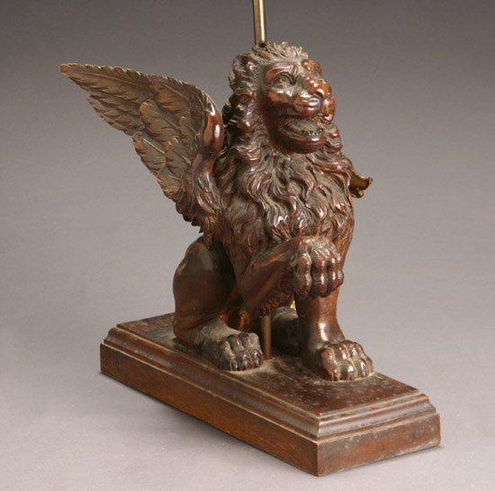 Appraisal: Continental Walnut Figure of a Winged Lion Late th Century