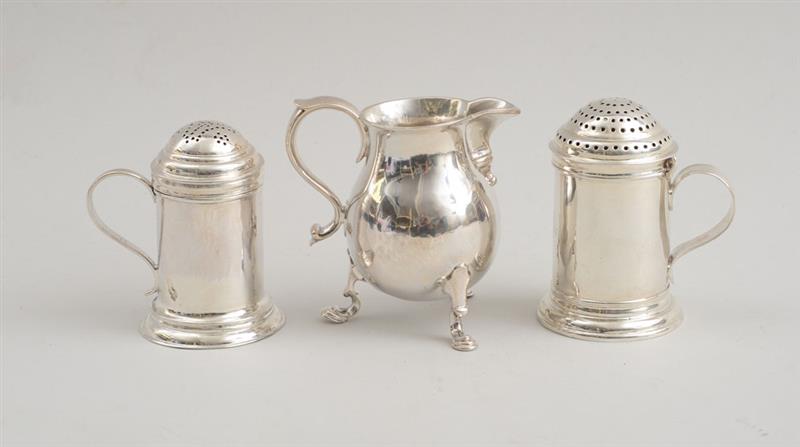 Appraisal: ENGLISH SILVER CREAMER AND TWO KITCHEN PEPPERS LONDON The first