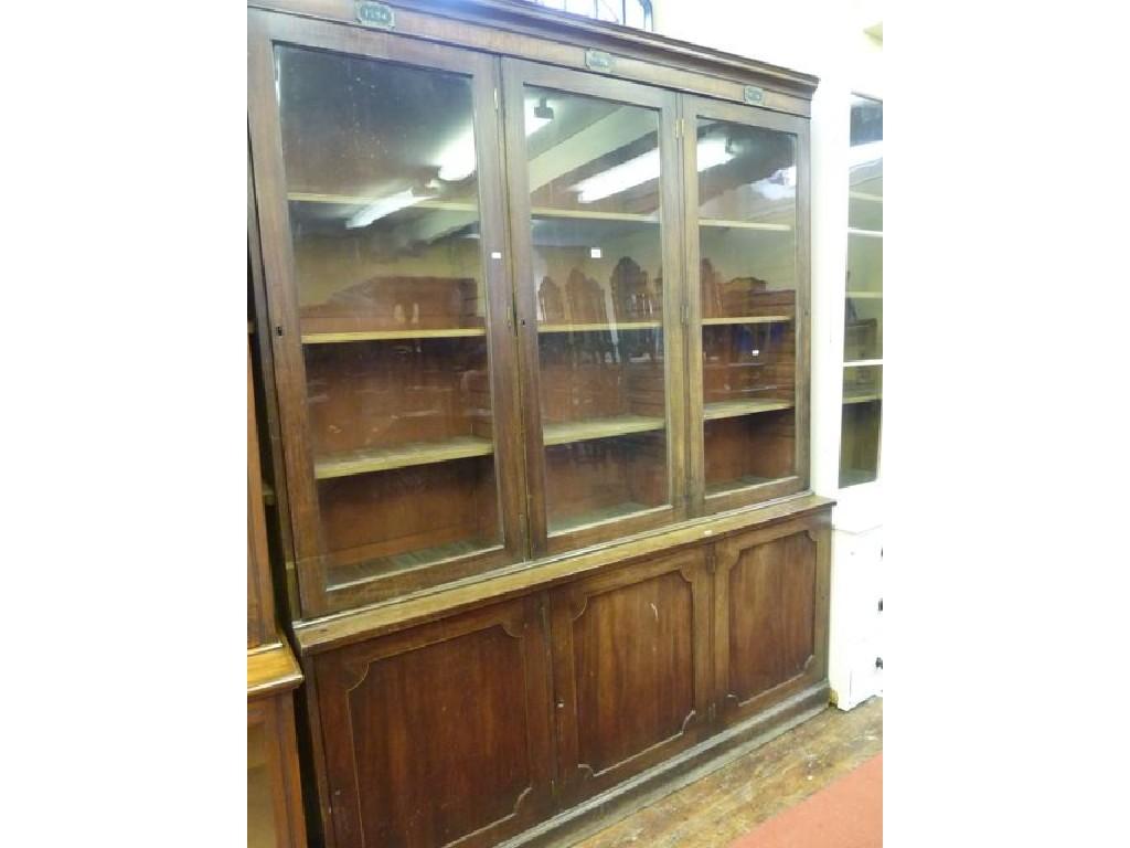 Appraisal: A th century mahogany library bookcase the upper section with