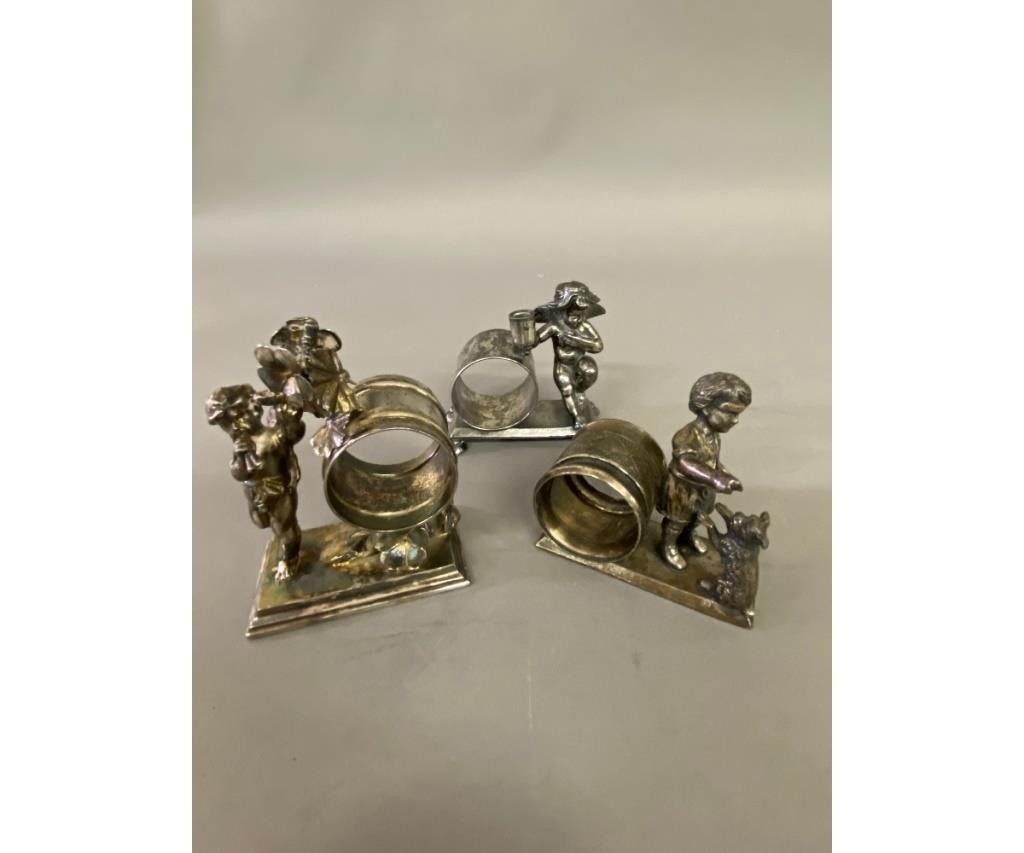 Appraisal: Three Victorian silver plate napkin rings to include a boy