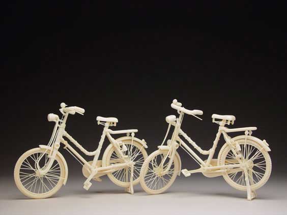 Appraisal: PAIR CARVED IVORY BICYCLES Pair of finely carved delicate Chinese