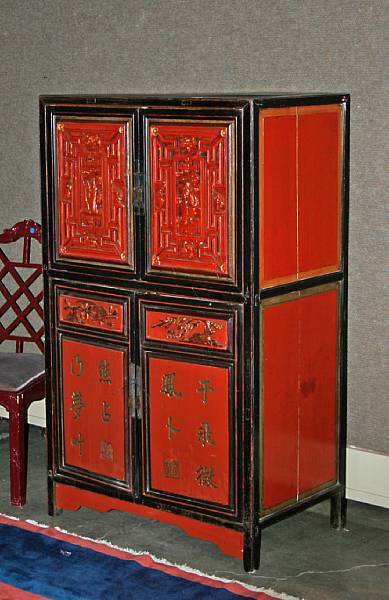 Appraisal: A Chinese painted wood four-door storage chest With carved figures