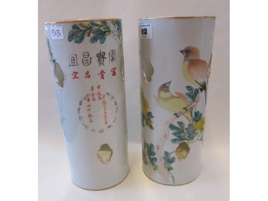 Appraisal: Pair of oriental cylindrical vases decorated with birds amongst a