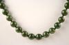 Appraisal: NECKLACE - Strand of forty-two mm jadeite beads with K