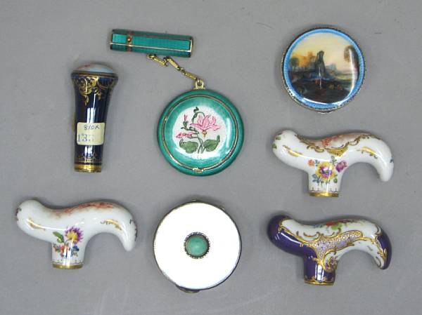 Appraisal: A group of silver compacts and porcelain parasol handles early