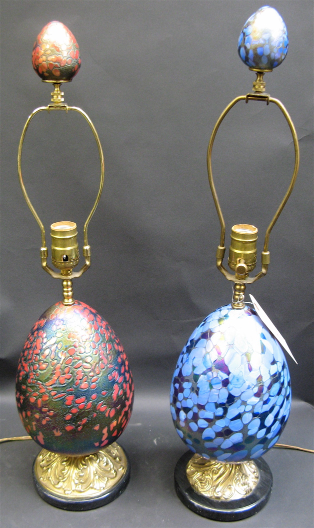 Appraisal: PAIR ART GLASS TABLE LAMPS Egg-shaped iridescent blue the other