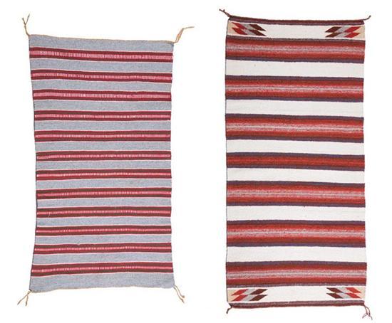 Appraisal: TWO NAVAJO TEXTILES Twentieth century The first striped in red