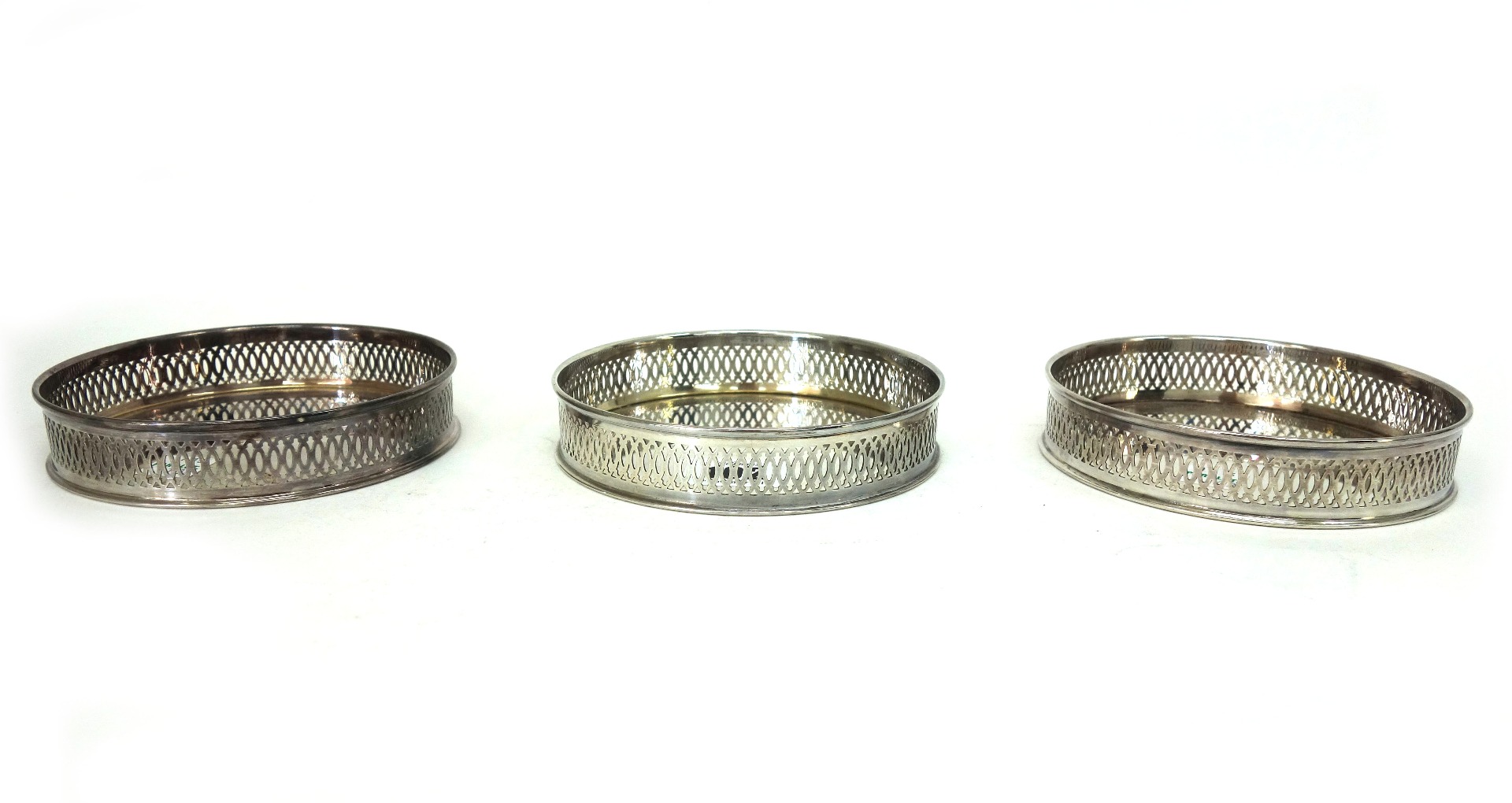 Appraisal: A set of three modern Italian silver coasters detailed with