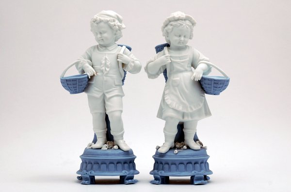 Appraisal: Pair of th century bisque figurines of boy and girl