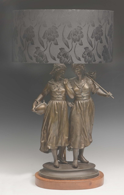 Appraisal: A SPELTER TABLE LAMP in the form of two country