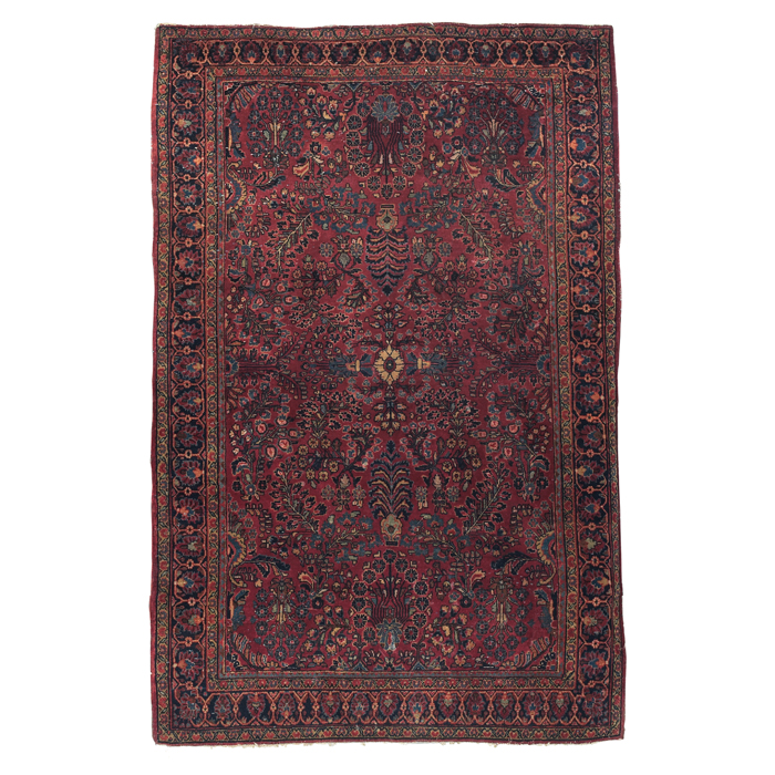 Appraisal: Sarouk rug c floral design on a red field minor