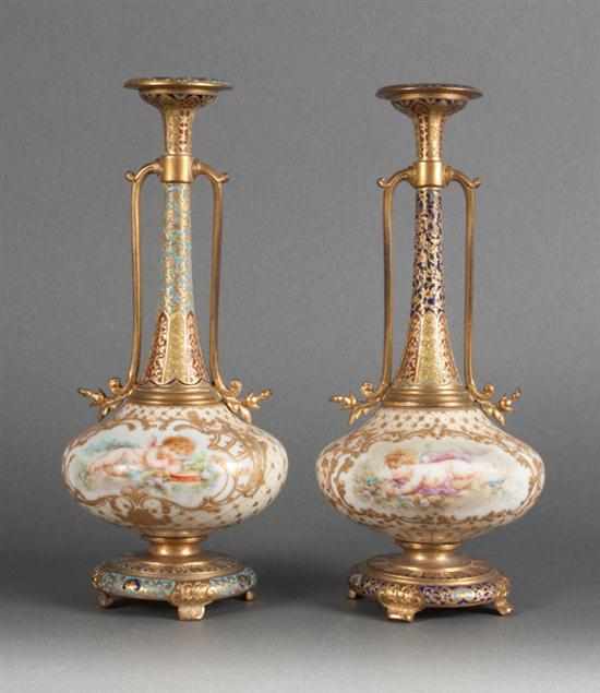 Appraisal: Pair French probably Limoges enameled gilt-metal-mounted porcelain clock garniture urns