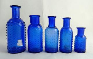 Appraisal: Poison round cobalt bottles Poison- round cobalt with lattice and