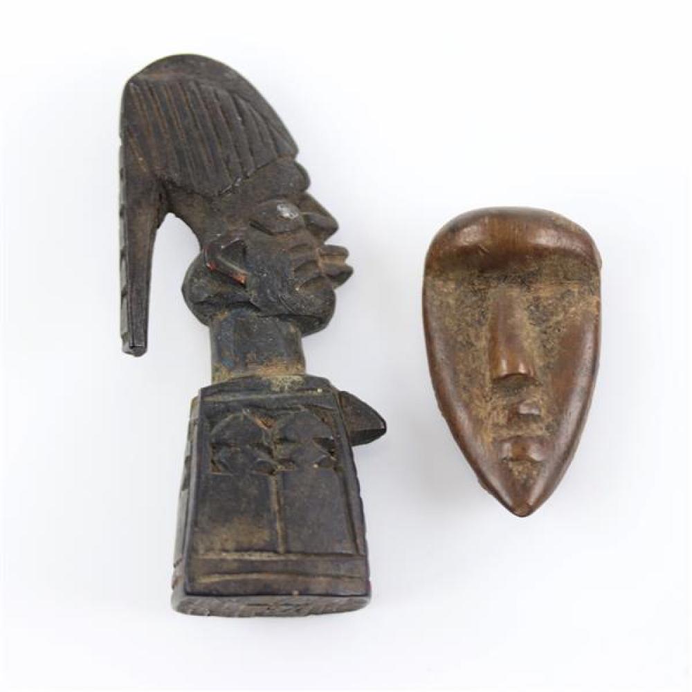 Appraisal: TWO AFRICAN CARVED WOOD FIGURES ESHU THE TRICKSTER GOD FROM