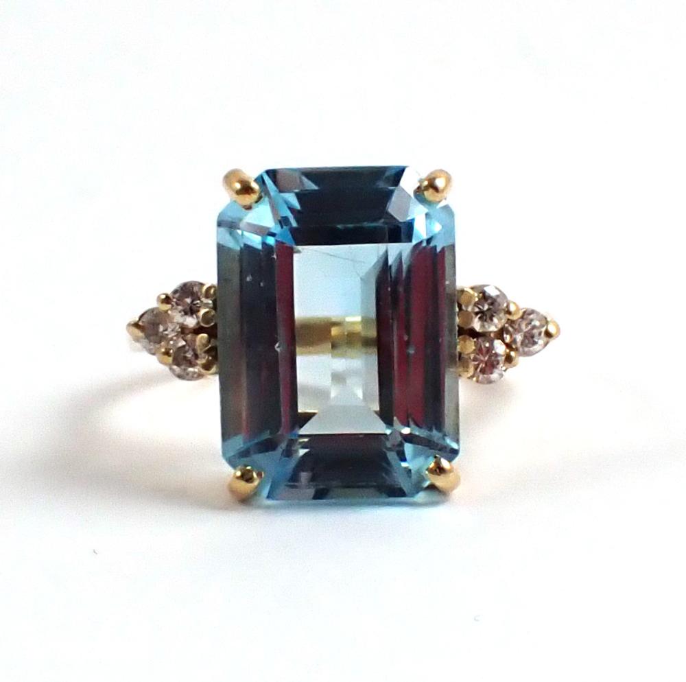 Appraisal: BLUE TOPAZ DIAMOND AND FOURTEEN KARAT GOLD RING with three