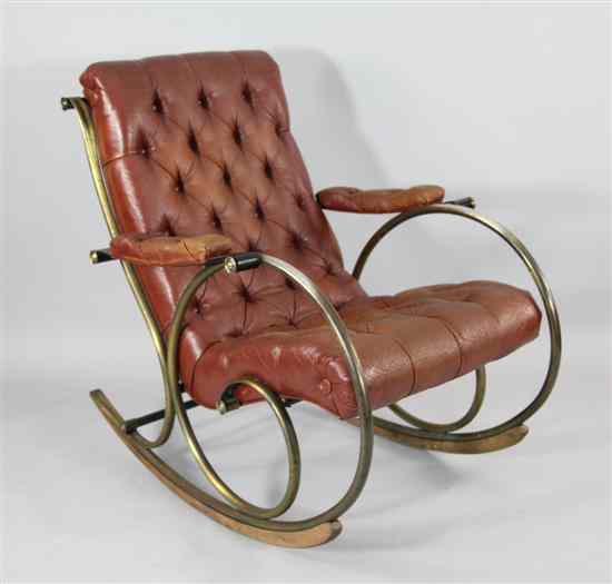 Appraisal: A Victorian design brass scroll frame rocking chair with buttoned