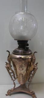 Appraisal: Victorian Silverplate Oil Lamp An unusual lamp with full winged