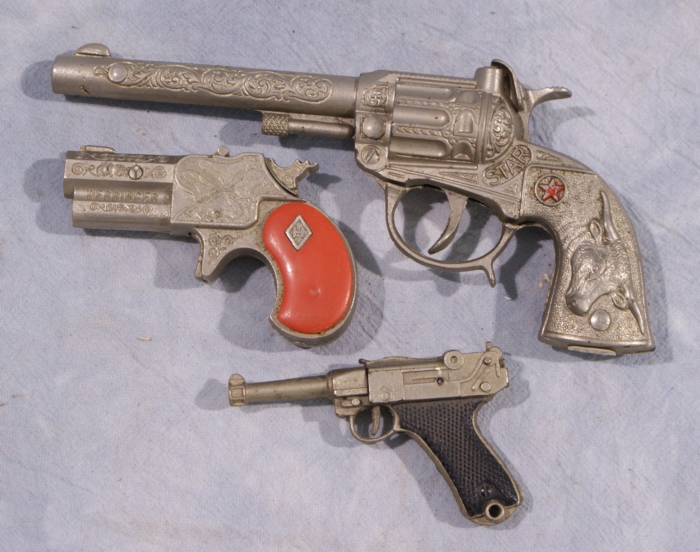 Appraisal: Miniature cap gun lot including guns one marked Derringer by