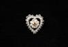 Appraisal: BROOCH - One K white gold heart shaped brooch set