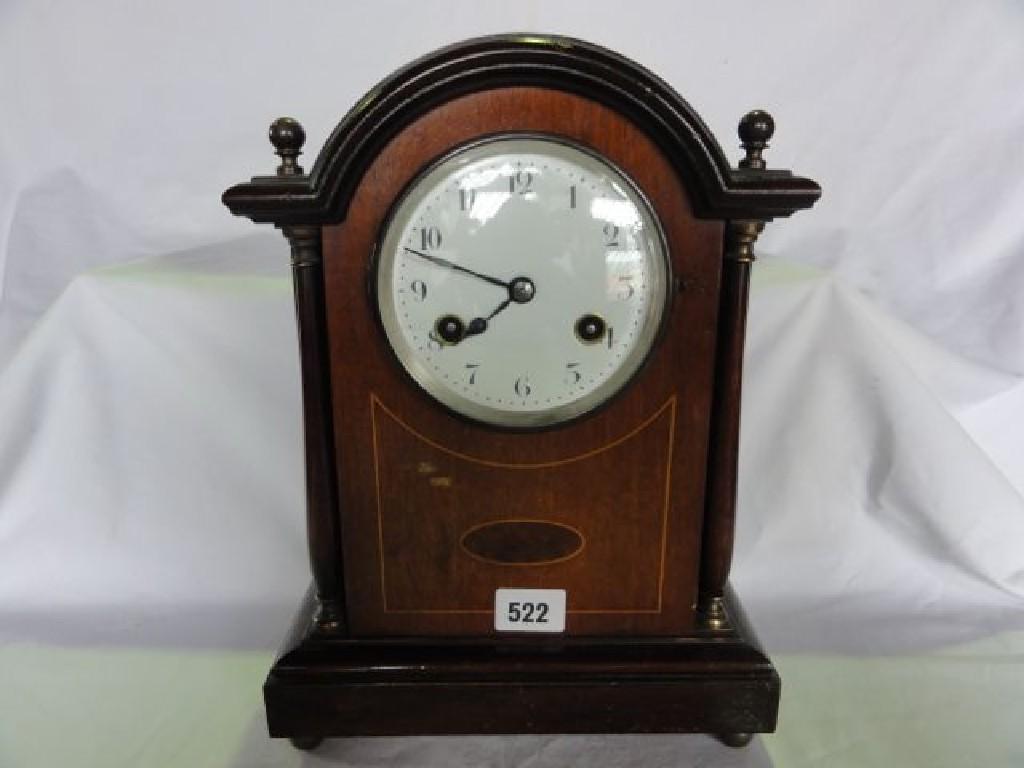 Appraisal: An Edwardian mahogany bracket clock with inlaid case column supports