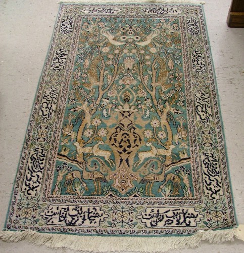 Appraisal: INDO-PERSIAN FAUX SILK PRAYER RUG the aquamarine field featuring a