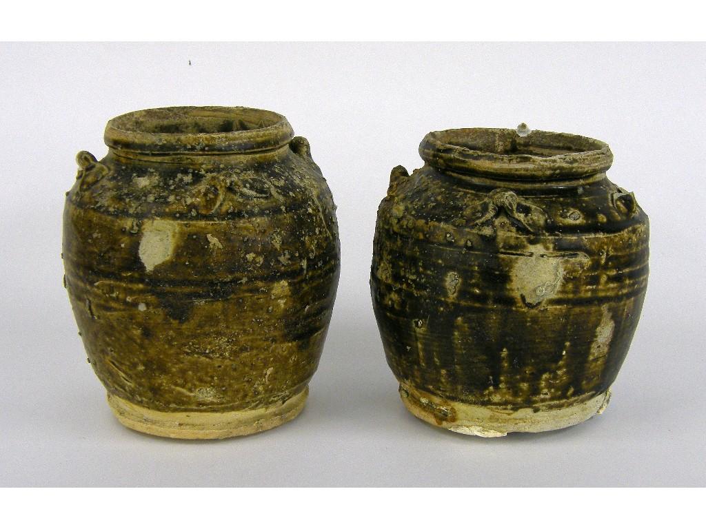 Appraisal: Pair of Diana Cargo brown glazed oviform storage jars circa