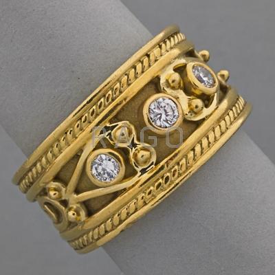 Appraisal: ARTISANAL ETRUSCAN STYLE K GOLD DIAMOND BAND Three circular cut