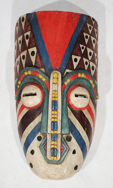 Appraisal: A TRIBAL MASK possibly African with polychrome decoration cm high