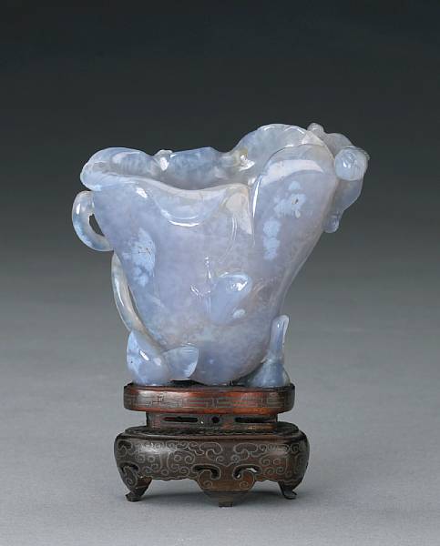 Appraisal: A blue chalcedony libation cup Formed as an up-turned lotus