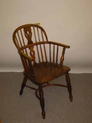 Appraisal: AN ASH AND ELM WINDSOR ARMCHAIR th century of low