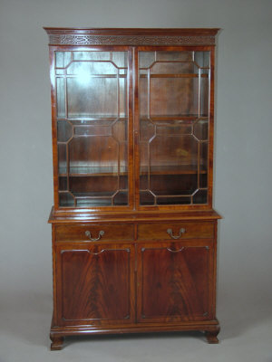 Appraisal: A mahogany glazed bookcase late th century molded cornice above