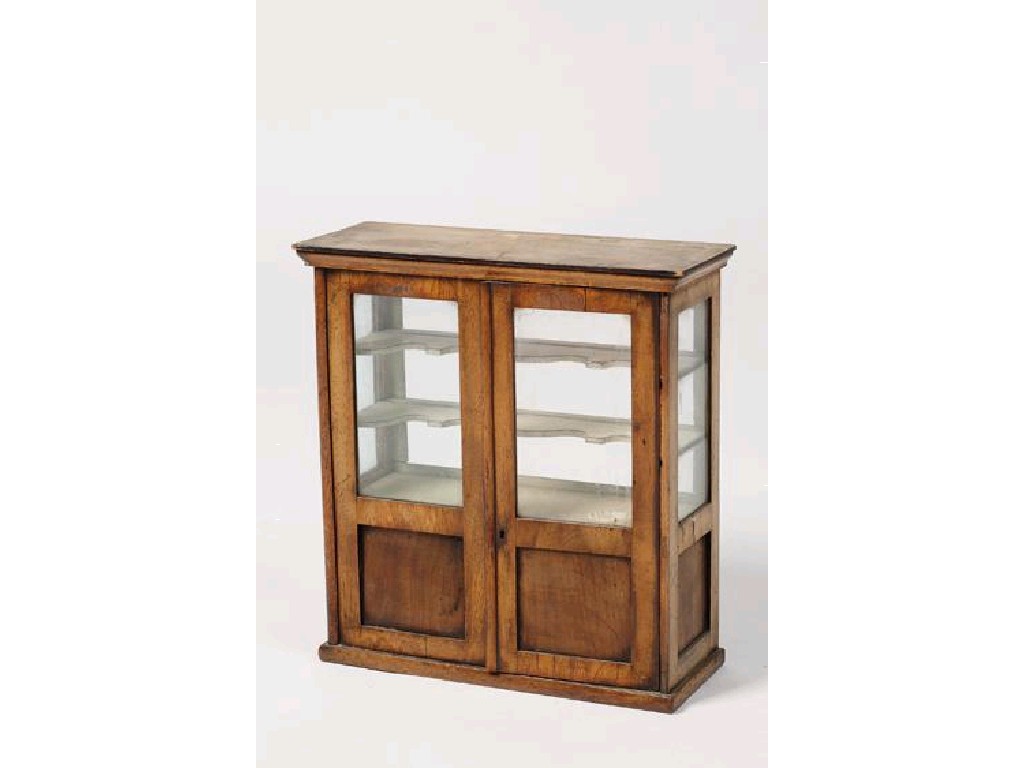 Appraisal: A MINIATURE VICTORIAN TWO DOOR CABINET the upper section with