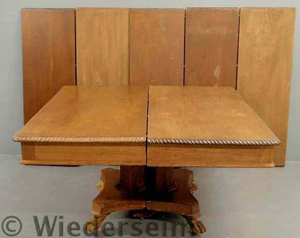 Appraisal: Mahogany banquet table with gadrooned edging animal paw feet and