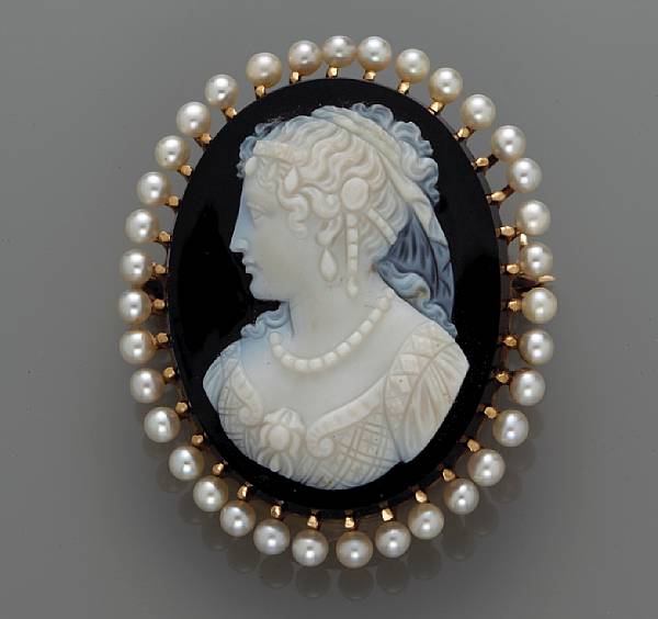 Appraisal: An agate and seed pearl cameo brooch-pendant mounted in fourteen