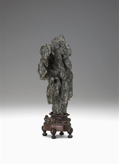 Appraisal: Chinese lingbi upright scholar's rock Single section of rich dark