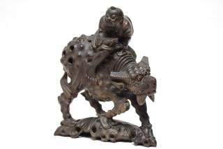 Appraisal: Chinese Hardwood Carving Boy on Mythical Beast Chinese carved wood