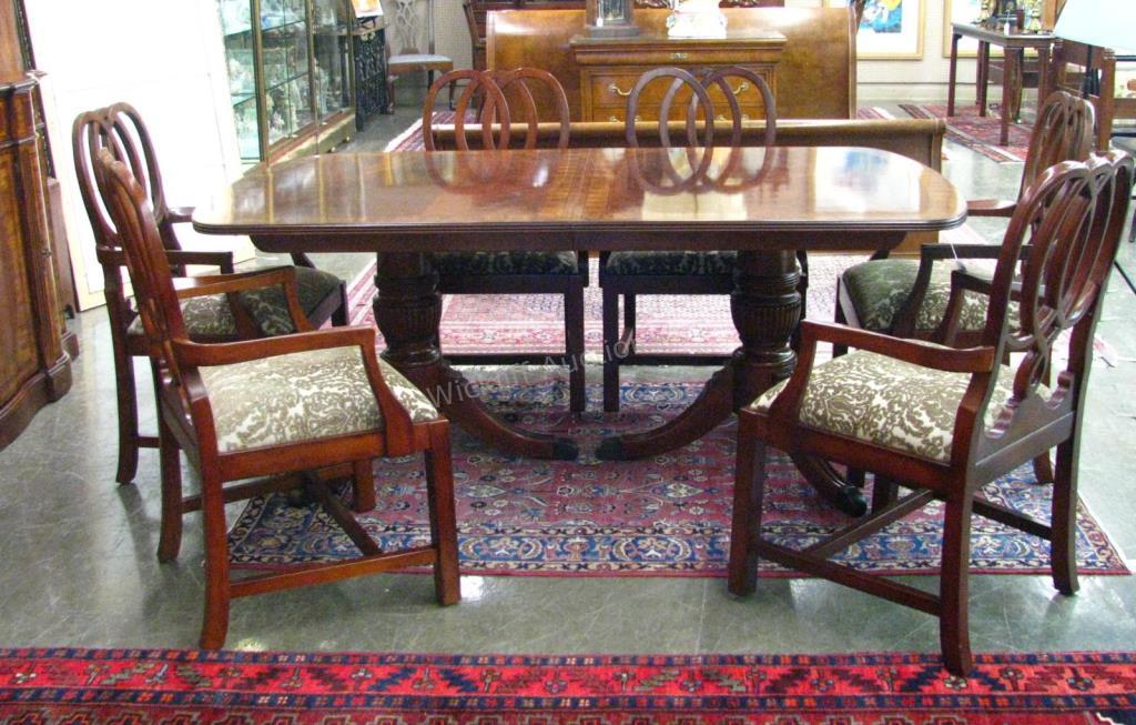 Appraisal: A period-style dining table and chairs by Bernhardt mahogany with