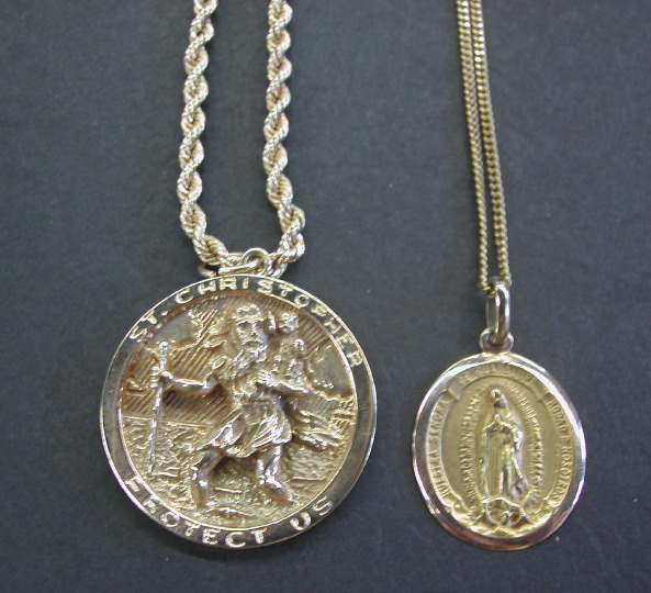 Appraisal: Two Religious Medals the first a fourteen-karat yellow gold St