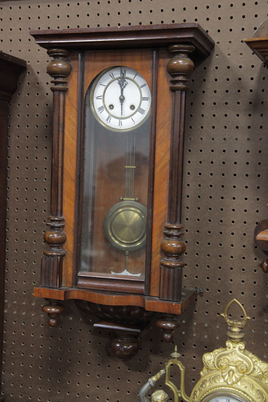 Appraisal: GERMAN WALL CLOCK Eight day clock with brass works porcelain