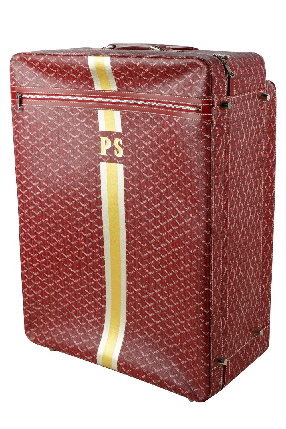 Appraisal: BURGUNDY GOYARD SUITCASEwith initials PS with dustbag having two wheels