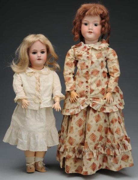 Appraisal: Lot of German Bisque Dolls Description German Ca Bisque socket