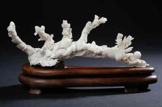 Appraisal: CHINESE WHITE CORAL CARVING OF BOYS AND RABBITS th century