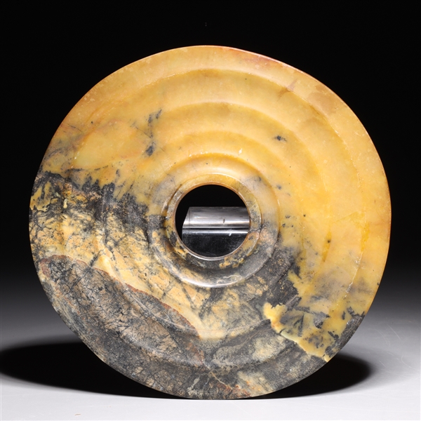 Appraisal: Chinese hardstone archaistic bi with concentric rings to surface overall