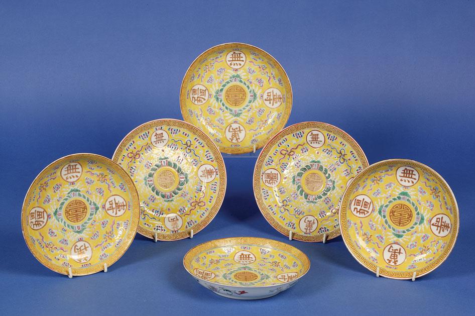 Appraisal: A SET OF FOUR CHINESE FAMILLE JAUNE PLATES enamelled in