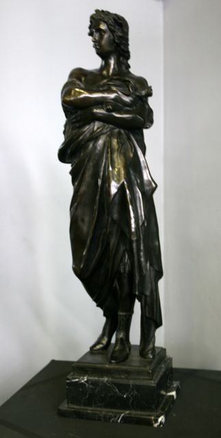 Appraisal: A bronze statue of a Roman scholar on a marble