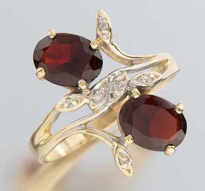 Appraisal: A Ladies' Garnet and Diamond Ring k yellow gold ring