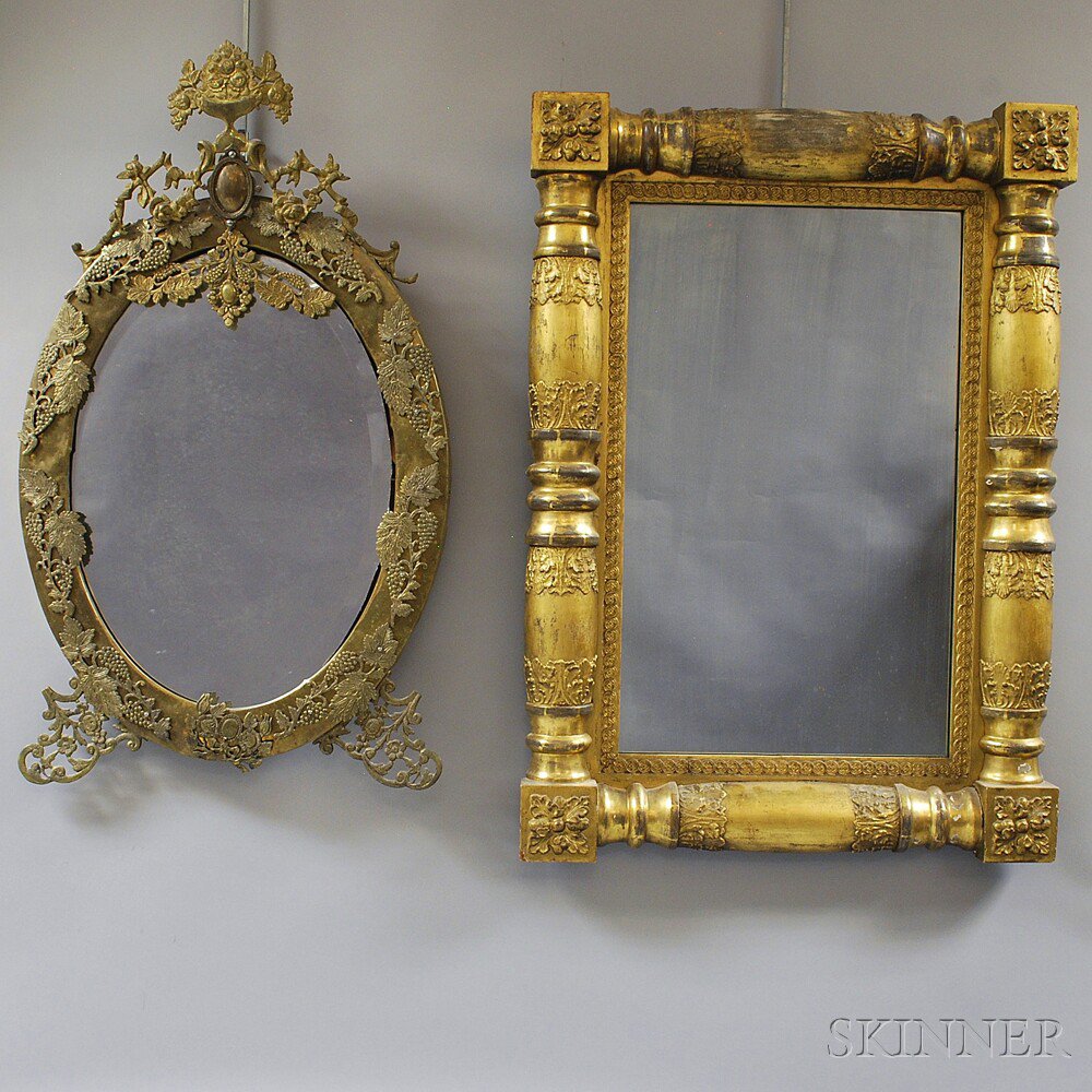 Appraisal: Two Mirrors a brass-mounted ovoid mirror with flowering urn cresting