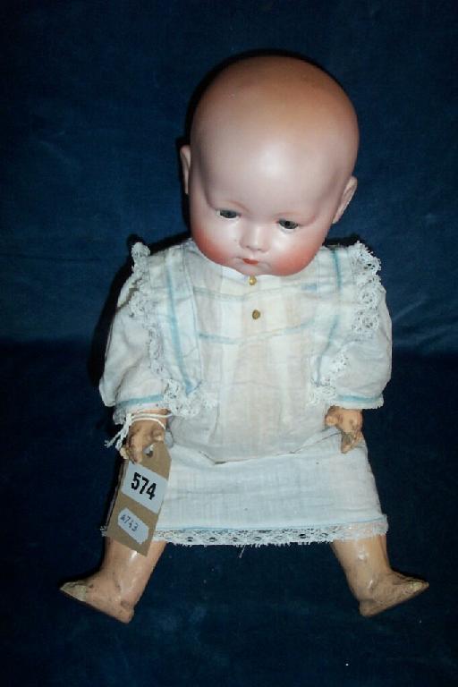 Appraisal: A German bisque headed baby doll with closing blue eyes