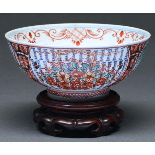 Appraisal: A European 'clobbered' Chinese blue and white bowl th c